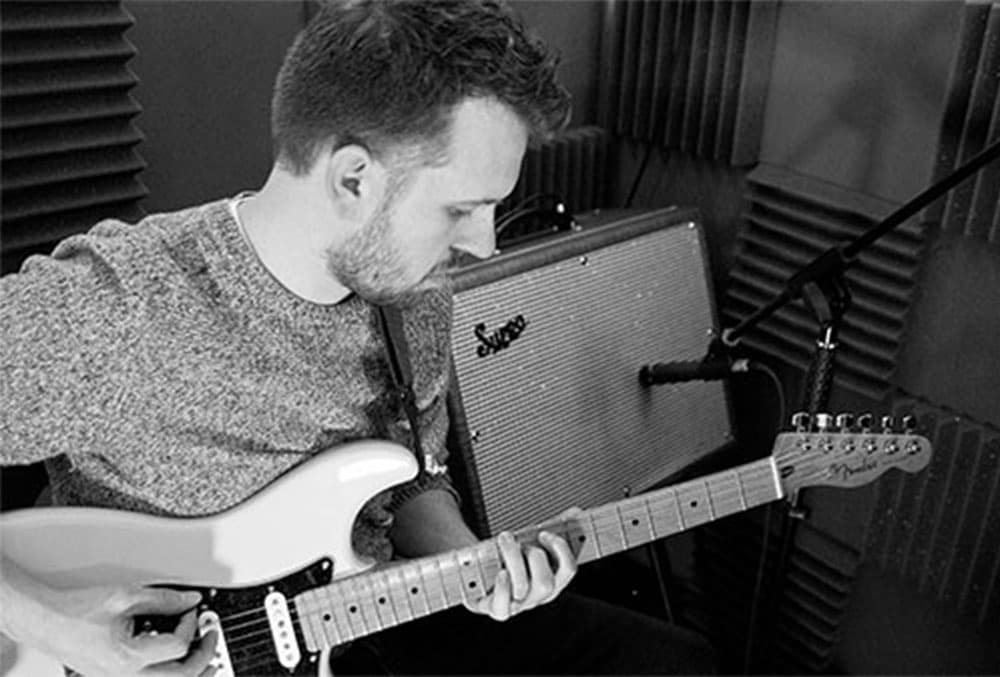 Steve Barkwill playing guitar